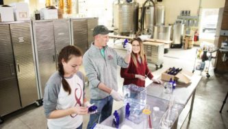 Eight Oaks Farm Distillery is temporarily converting its operation into a production line for hand sanitister. [MATT ROURKE/AP]