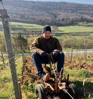 Sebastian Fürst plows one of his steep vineyards in Franken. Vineyard work continues, with workers staying two meters apart. (Photo courtesy of Rudolf Fürst)