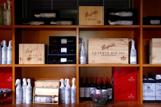 Bottles of Penfolds Grange wine and other varieties, made by Australian wine maker Penfolds and owned by Australia's Treasury Wine Estates, sit on shelves for sale at a winery located in the Hunter Valley, north of Sydney, Australia, February 14, 2018. REUTERS/David Gray/File Photo